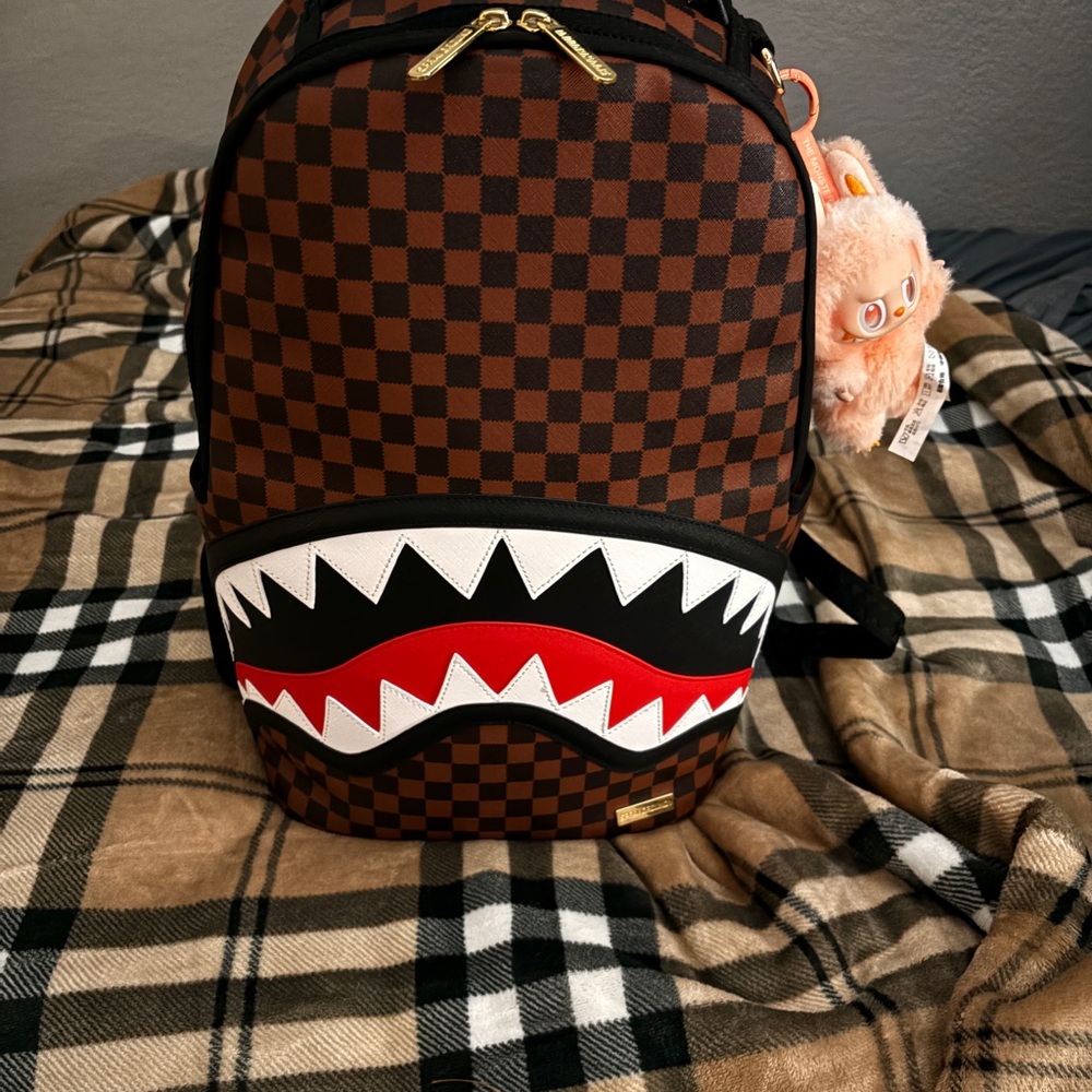 Brown sprayground with free labubu real